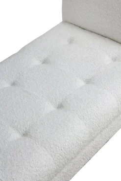 Banc recouvert de tissu blanc et pieds en bois noir