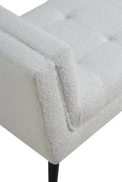 Banc recouvert de tissu blanc et pieds en bois noir