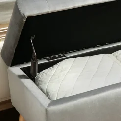 Banquette coffre design scandinave piètement effilé bois assise effet capitonné velours gris