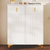 Buffet haut laqué blanc et bois, design sans poignées, portes inclinées, charnières amorties