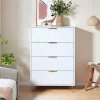 Commode 4 tiroirs blanche avec façades à motif losange en relief, panneaux mélaminés, grande capacité de rangement et robuste