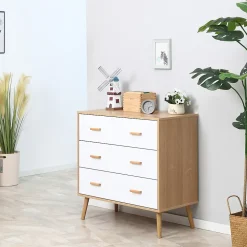 Commode design scandinave sur pieds 3 tiroirs coulissants pieds effilés inclinés panneaux particules blanc aspect bois clair