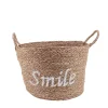 Panier rond brodé "Smile" en jonc de mer