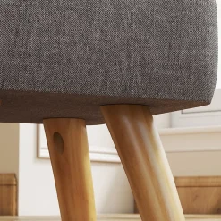 Pouf repose-pieds style nordique piètement bois incliné tissu assise effet capitonné gris