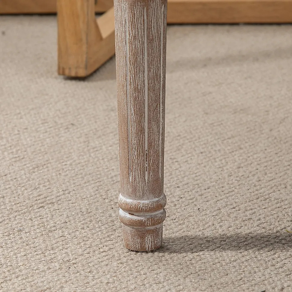 Tabouret repose-pied capitonné style classique - bois d'hévéa sculpté, patiné - revêtement aspect lin beige